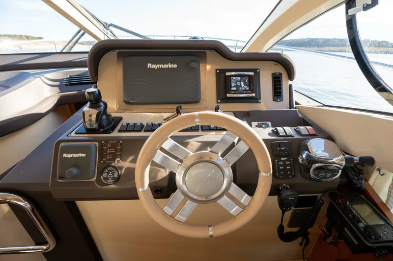 Yacht Photos Pics Azimut 40 Flybridge 2013 helm with Raymarine navigation system and modern controls.