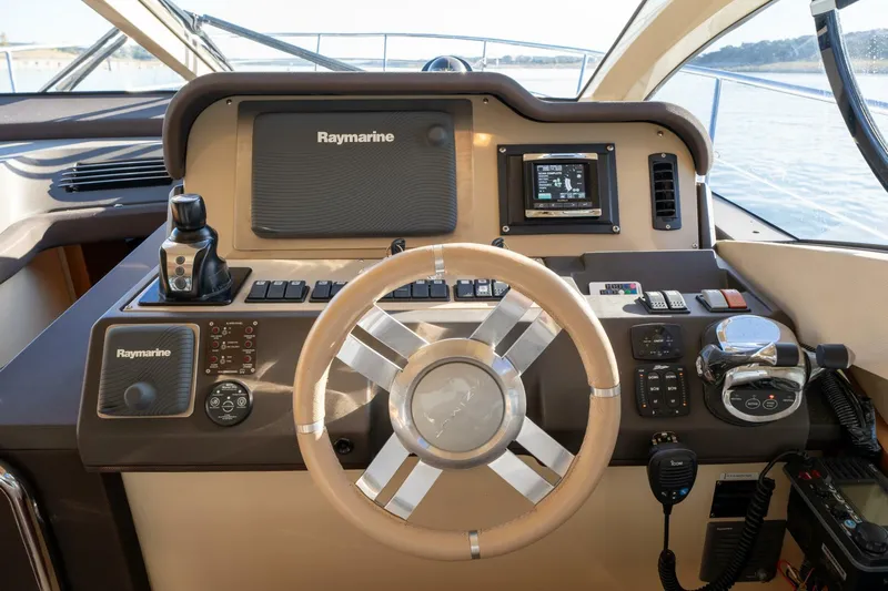  Yacht Photos Pics Azimut 40 Flybridge 2013 yacht helm with Raymarine navigation system and steering wheel.
