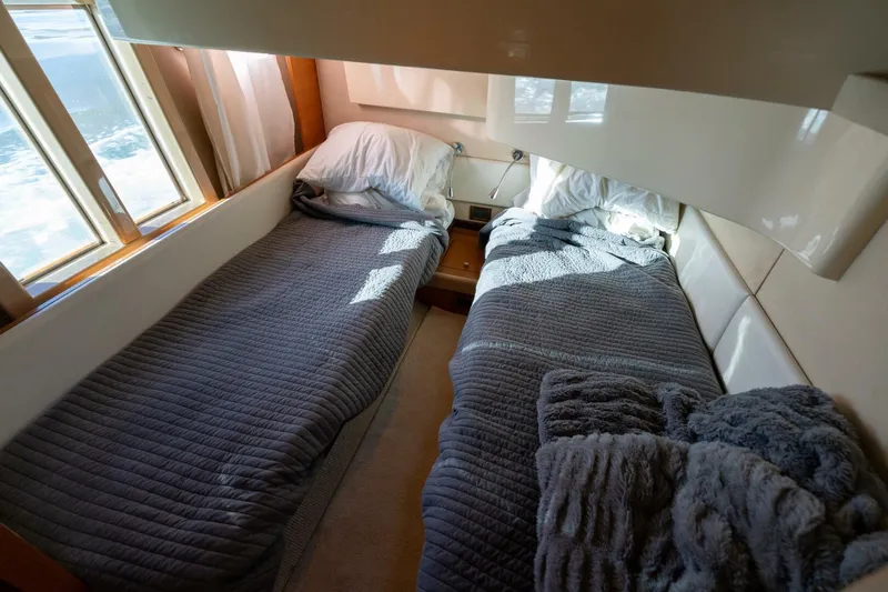  Yacht Photos Pics Cozy twin beds in 2013 Azimut 40 Flybridge cabin with natural light.