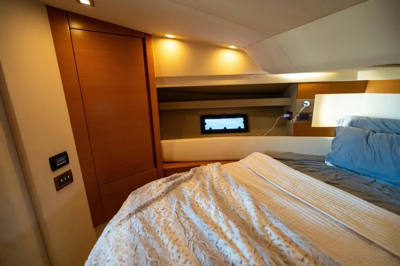  Yacht Photos Pics Luxurious bedroom interior of 2013 Azimut 40 Flybridge yacht with cozy bedding.