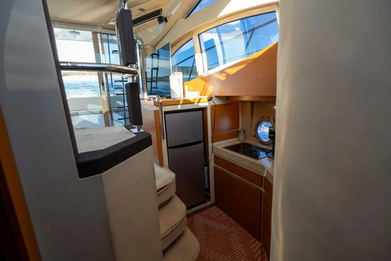  Yacht Photos Pics Interior of 2013 Azimut 40 Flybridge yacht, featuring kitchen and stairs.