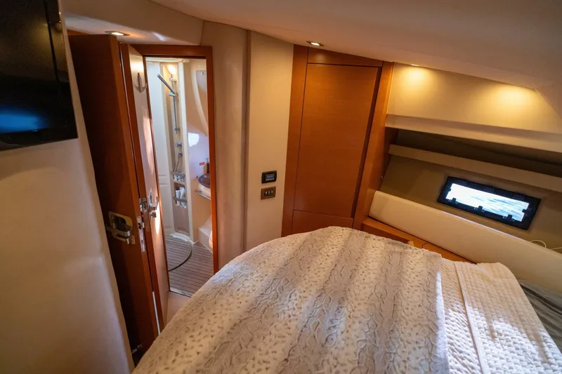  Yacht Photos Pics Luxurious bedroom interior of 2013 Azimut 40 Flybridge yacht with ensuite bathroom.