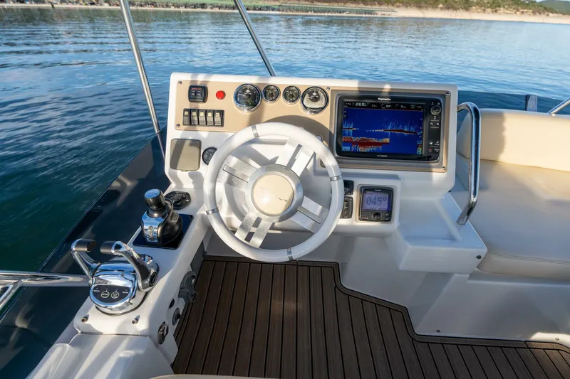  Yacht Photos Pics Azimut 40 Flybridge 2013 yacht helm with navigation controls and sea view.