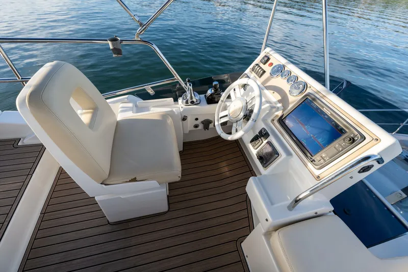  Yacht Photos Pics 2013 Azimut 40 Flybridge helm with modern controls and navigation system.