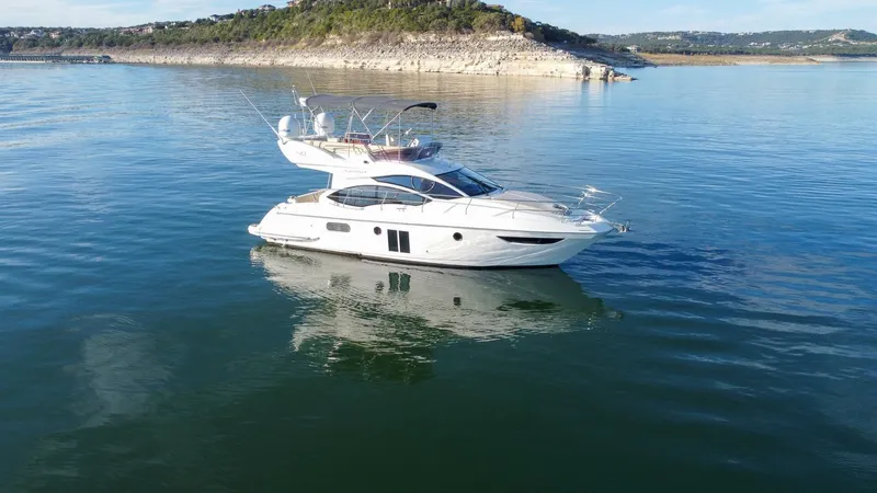  Yacht Photos Pics Azimut 40 Flybridge 2013 yacht on calm water with scenic background.