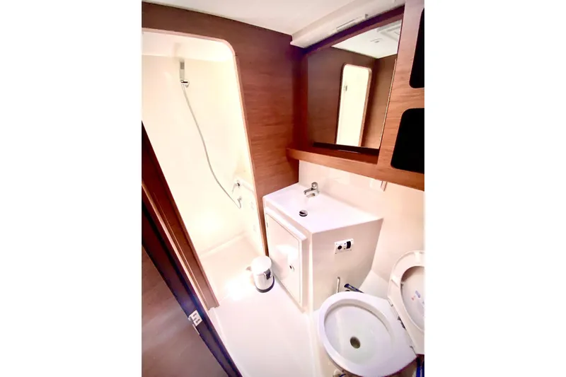 Keyma Yacht Photos Pics Bathroom interior of 2020 Lagoon 42 yacht with shower, sink, and toilet.