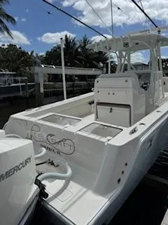 Reel Craft Yacht Photos Pics 2024 SeaVee 340Z boat docked, featuring a sleek design and Mercury engine.