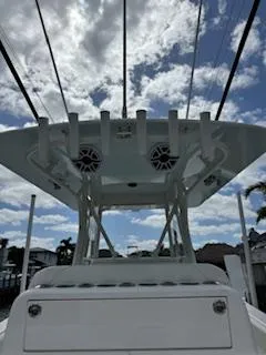 Reel Craft Yacht Photos Pics 2024 SeaVee 340Z boat with T-top and rod holders under a cloudy sky.