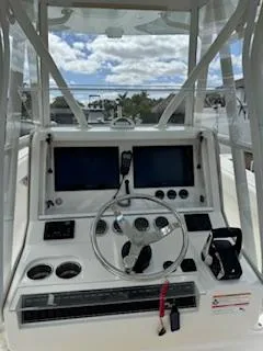 Reel Craft Yacht Photos Pics 2024 SeaVee 340Z boat dashboard with dual screens and steering wheel.