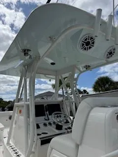 Reel Craft Yacht Photos Pics 2024 SeaVee 340Z boat interior with modern helm and seating under a canopy.