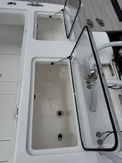 Reel Craft Yacht Photos Pics 2024 SeaVee 340Z boat with open storage compartments and sleek design.