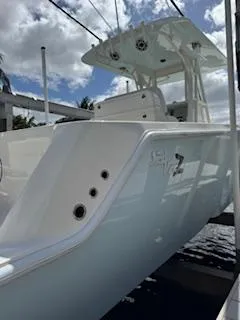 Reel Craft Yacht Photos Pics 2024 SeaVee 340Z boat docked under a cloudy sky.