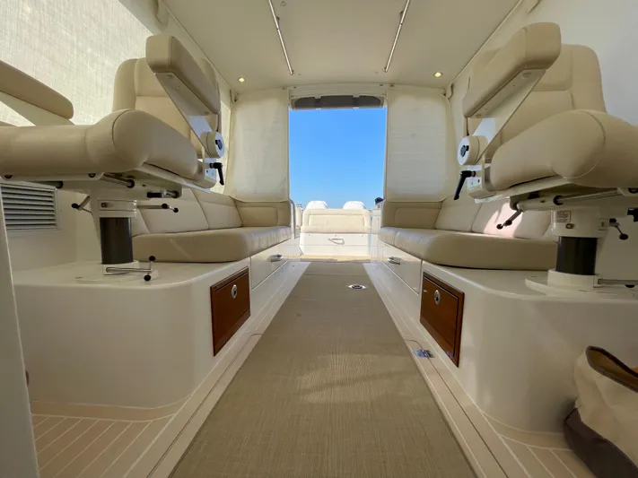 Corsair Yacht Photos Pics Luxurious interior of 2020 MJM 35z boat with beige seating and wooden accents.