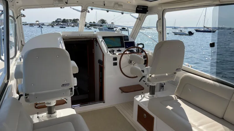 Corsair Yacht Photos Pics Interior of 2020 MJM 35z boat with helm, seating, and ocean view.