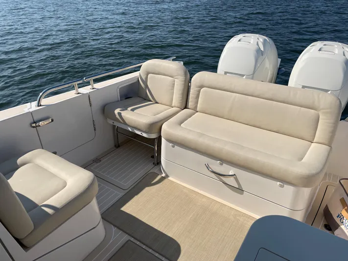 Corsair Yacht Photos Pics 2020 MJM 35z boat interior with beige seating and twin engines on the water.
