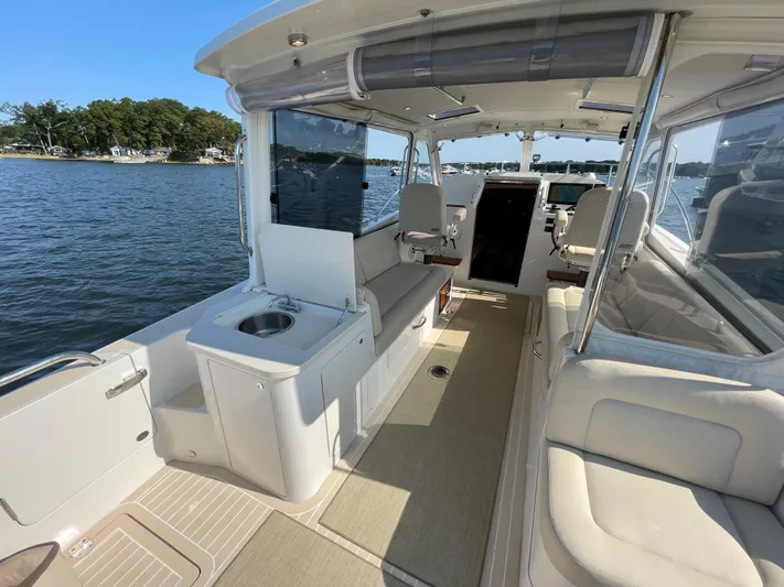 Corsair Yacht Photos Pics 2020 MJM 35z boat interior with seating, water view, and open cabin layout.