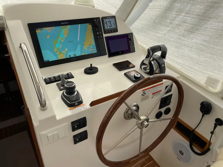 Corsair Yacht Photos Pics Cockpit of 2020 MJM 35z boat with navigation screens and steering wheel.