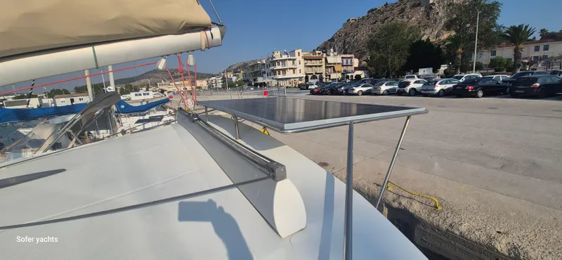  Yacht Photos Pics Fountaine Pajot Lipari 41 catamaran with solar panel, docked at a marina, 2011 model.