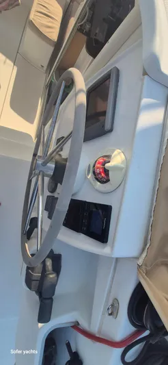  Yacht Photos Pics Helm of 2011 Fountaine Pajot Lipari 41 catamaran with steering wheel and navigation instruments.