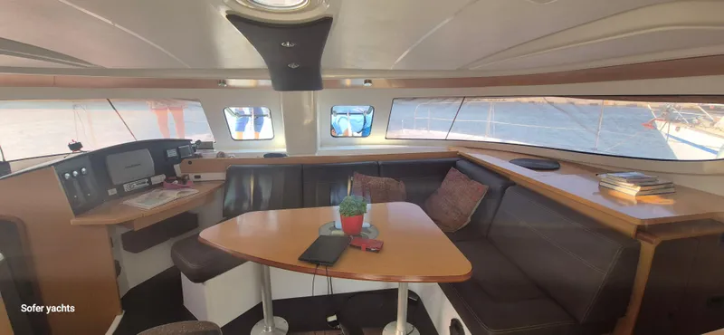  Yacht Photos Pics Interior of 2011 Fountaine Pajot Lipari 41 catamaran with seating and navigation area.
