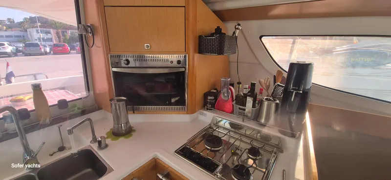  Yacht Photos Pics Interior of 2011 Fountaine Pajot Lipari 41 yacht kitchen with stove and appliances.