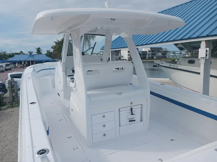  Yacht Photos Pics 2024 Intrepid 375 Nomad SE boat with sleek white design and spacious deck.
