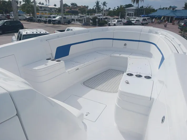  Yacht Photos Pics 2024 Intrepid 375 Nomad SE boat with spacious seating and sleek design.