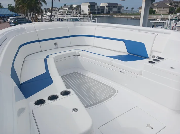  Yacht Photos Pics 2024 Intrepid 375 Nomad SE boat with spacious seating and modern design.