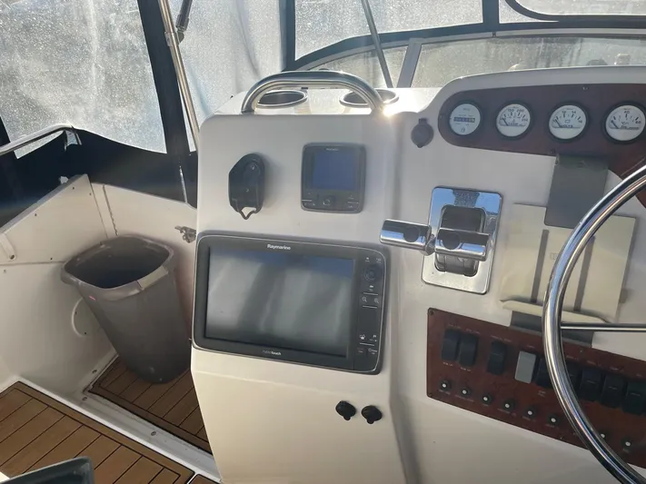  Yacht Photos Pics 1999 Silverton 392 Motor Yacht helm with navigation equipment and gauges.