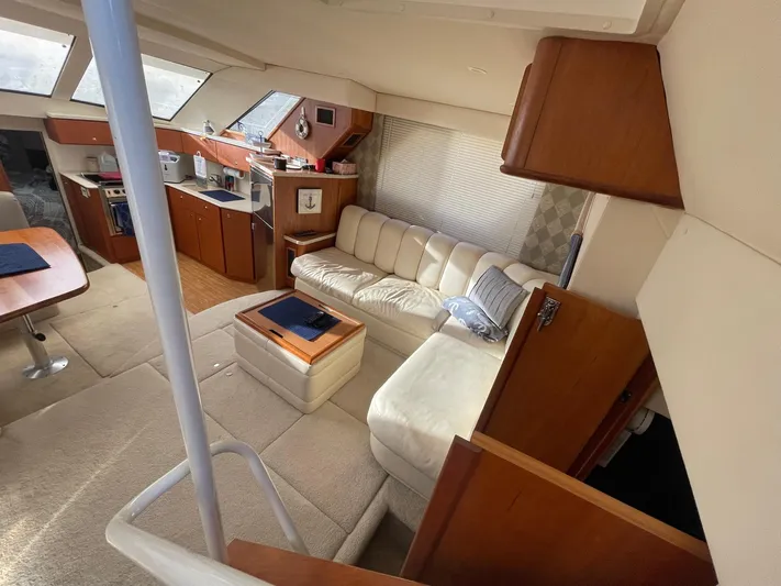 Yacht Photos Pics Interior of 1999 Silverton 392 Motor Yacht with cozy seating and kitchen area.