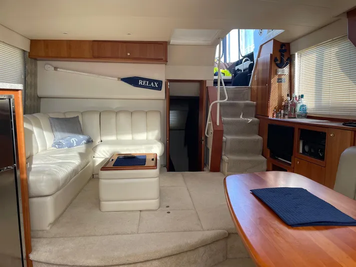  Yacht Photos Pics Interior of 1999 Silverton 392 Motor Yacht with cozy seating and elegant wood finishes.