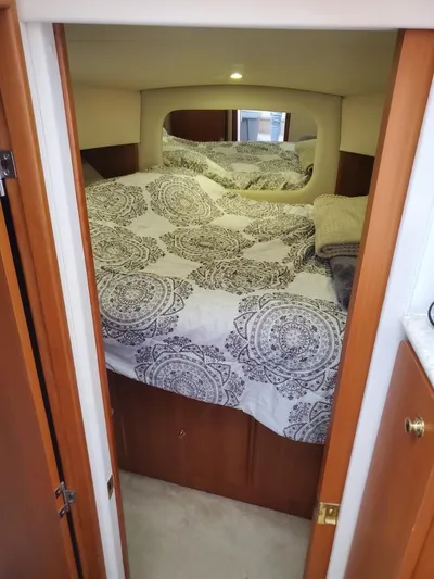  Yacht Photos Pics Cozy bedroom in 1999 Silverton 392 Motor Yacht with patterned bedding.