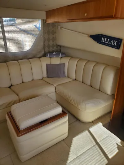 Yacht Photos Pics 1999 Silverton 392 Motor Yacht interior with cream leather seating and "Relax" decor.