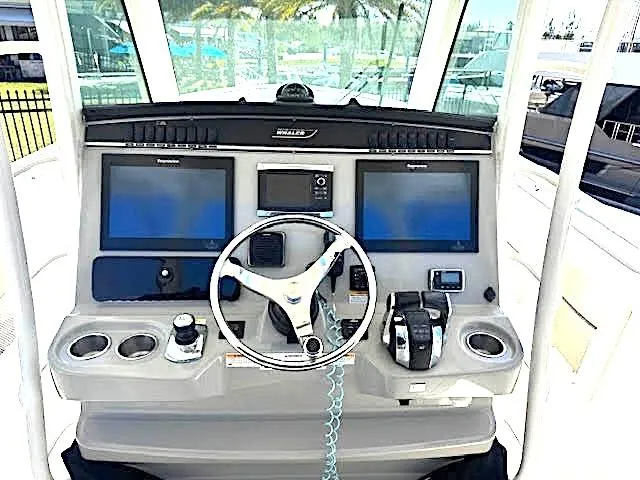  Yacht Photos Pics 2016 Boston Whaler 350 Outrage helm with dual screens and steering wheel.