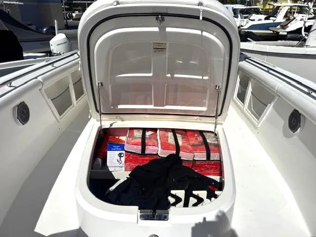  Yacht Photos Pics 2016 Boston Whaler 350 Outrage storage compartment with life jackets and supplies.