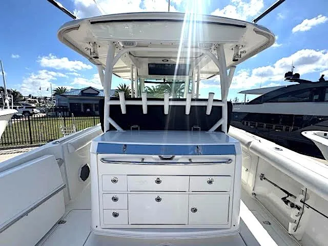 Yacht Photos Pics 2016 Boston Whaler 350 Outrage boat interior with rod holders and storage drawers.