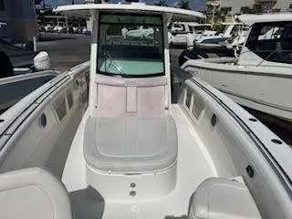  Yacht Photos Pics 2016 Boston Whaler 350 Outrage boat, spacious deck, white interior, docked at marina.