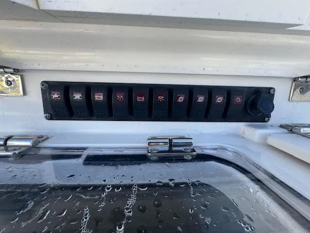  Yacht Photos Pics Control panel on a 2016 Boston Whaler 350 Outrage boat with multiple switches.