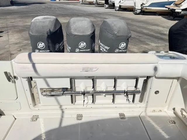  Yacht Photos Pics 2016 Boston Whaler 350 Outrage boat with covered Mercury engines and fishing rod holders.