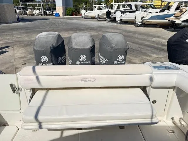  Yacht Photos Pics Boston Whaler 350 Outrage 2016 with Mercury engine covers, docked at a marina.