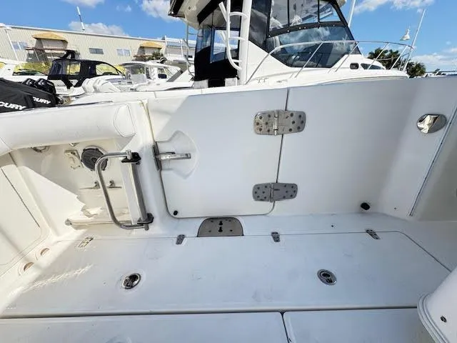  Yacht Photos Pics 2016 Boston Whaler 350 Outrage boat deck with storage compartments and seating.