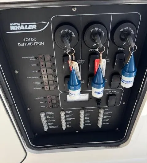  Yacht Photos Pics Control panel of a 2016 Boston Whaler 350 Outrage boat, featuring 12V DC distribution.