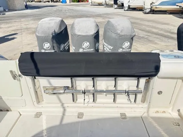  Yacht Photos Pics 2016 Boston Whaler 350 Outrage boat with covered Mercury engines at dock.