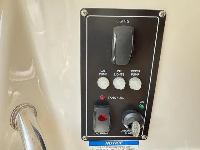 Yacht Photos Pics Control panel on a 2016 Boston Whaler 350 Outrage boat, featuring pump and light switches.