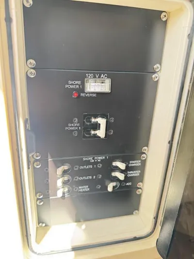  Yacht Photos Pics Electrical panel on a 2016 Boston Whaler 350 Outrage boat, showing shore power controls.