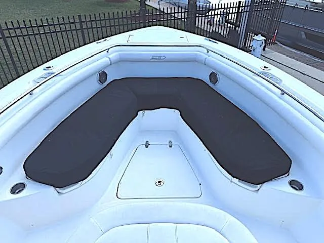  Yacht Photos Pics 2016 Boston Whaler 350 Outrage boat interior with cushioned seating area.