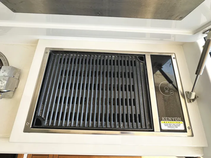 Forever Young Yacht Photos Pics Built-in Kenyon grill on 2019 Sunseeker Predator 57 yacht.