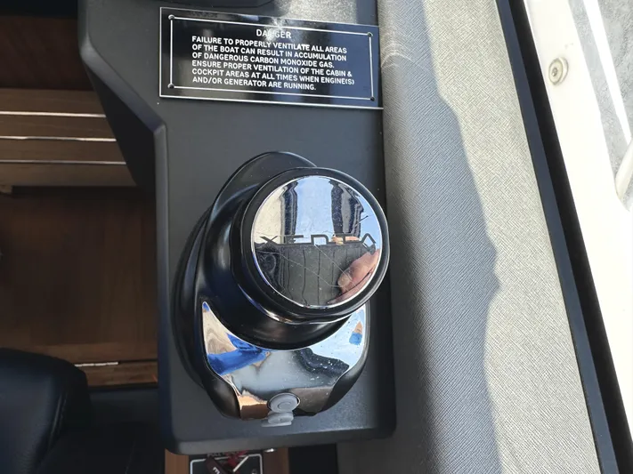 Forever Young Yacht Photos Pics Control knob on 2019 Sunseeker Predator 57 yacht with safety warning label.