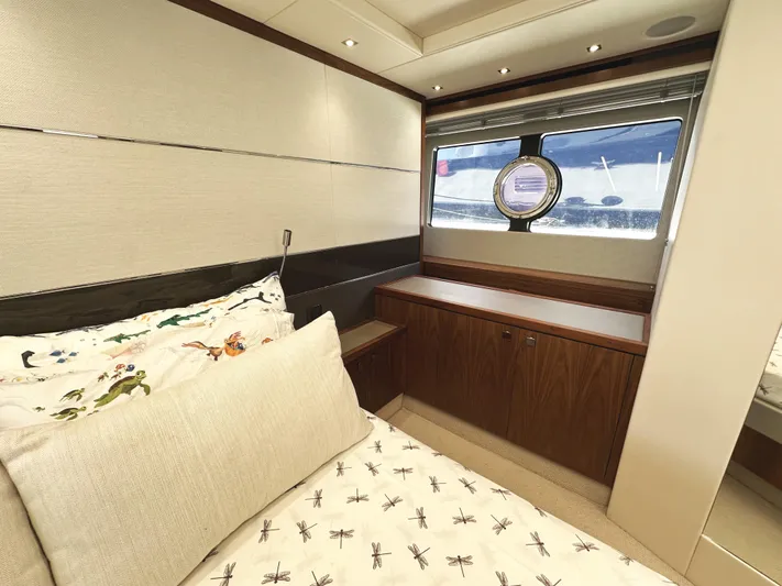 Forever Young Yacht Photos Pics Luxurious cabin interior of 2019 Sunseeker Predator 57 yacht with elegant bedding.