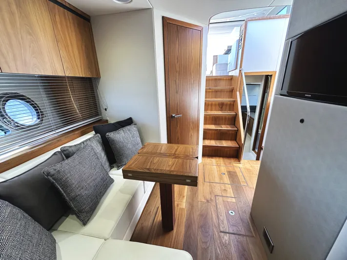 Forever Young Yacht Photos Pics Interior of 2019 Sunseeker Predator 57 yacht with wooden finishes and modern design.